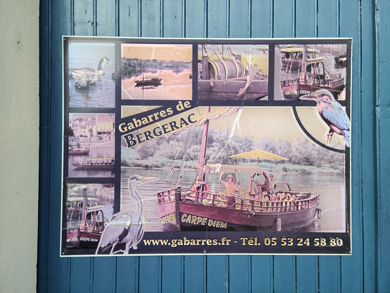 Vintage Gabarres de Bergerac river tour poster on a teal wall showing traditional flat-bottomed gabare boats and wildlife on the Dordogne