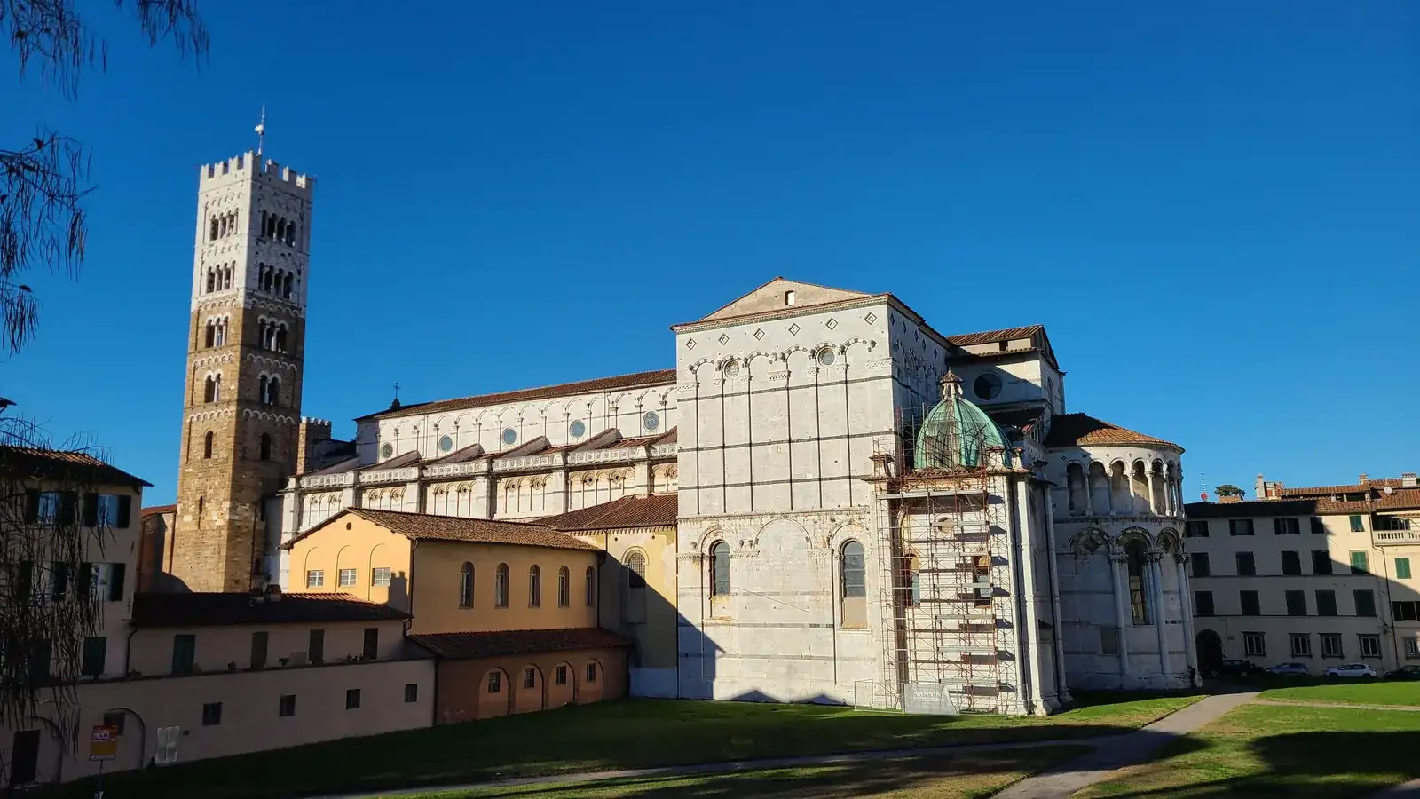The exterior of Lucca's Cattedrale di San Martino showing the bell tower and Pisan Romanesque marble facade