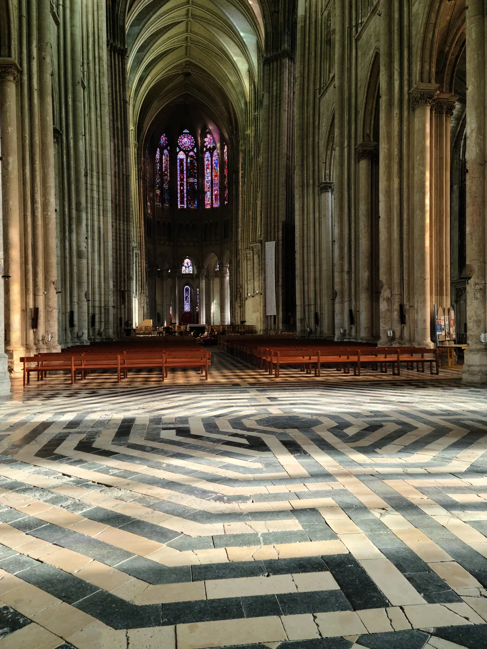 Medieval labyrinth inlaid in the stone floor of the Basilique de Saint-Quentin nave, laid in 1495