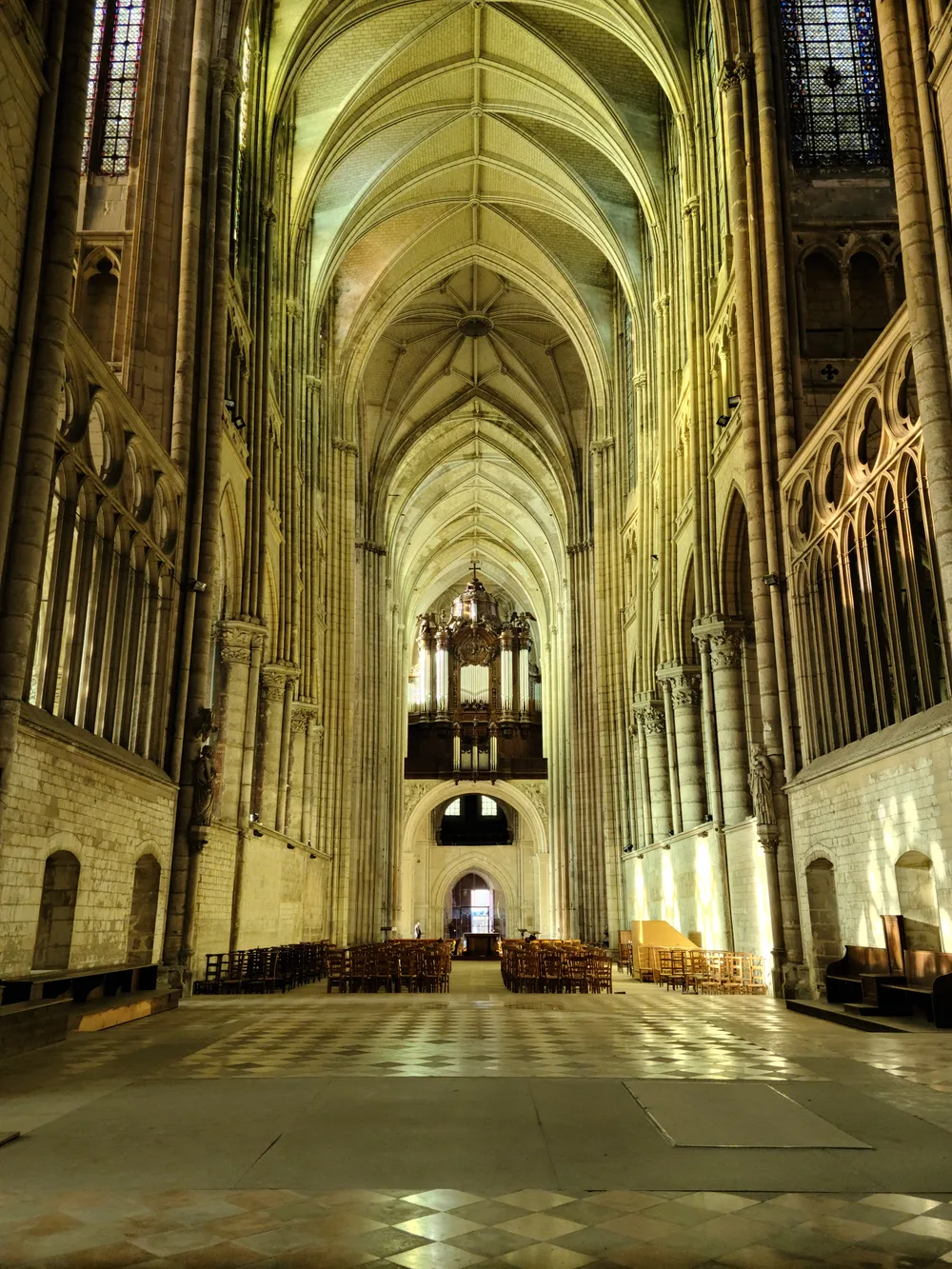 Gothic ribbed vaulted ceiling of the Basilique de Saint-Quentin nave looking upward