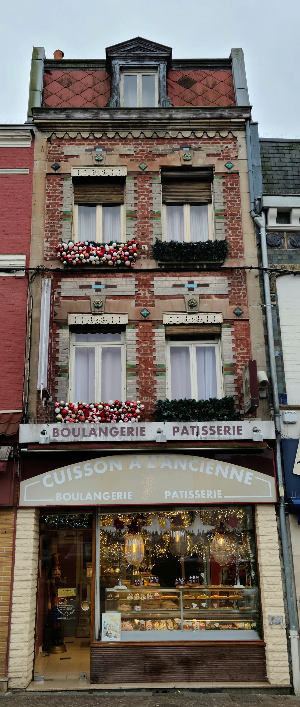 Art Deco boulangerie facade decorated for Christmas in Saint-Quentin, northern France