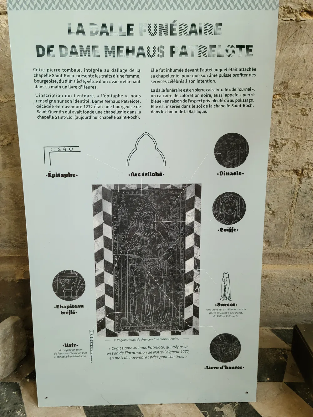 Interpretive information panel describing medieval funerary slabs in the Basilique de Saint-Quentin