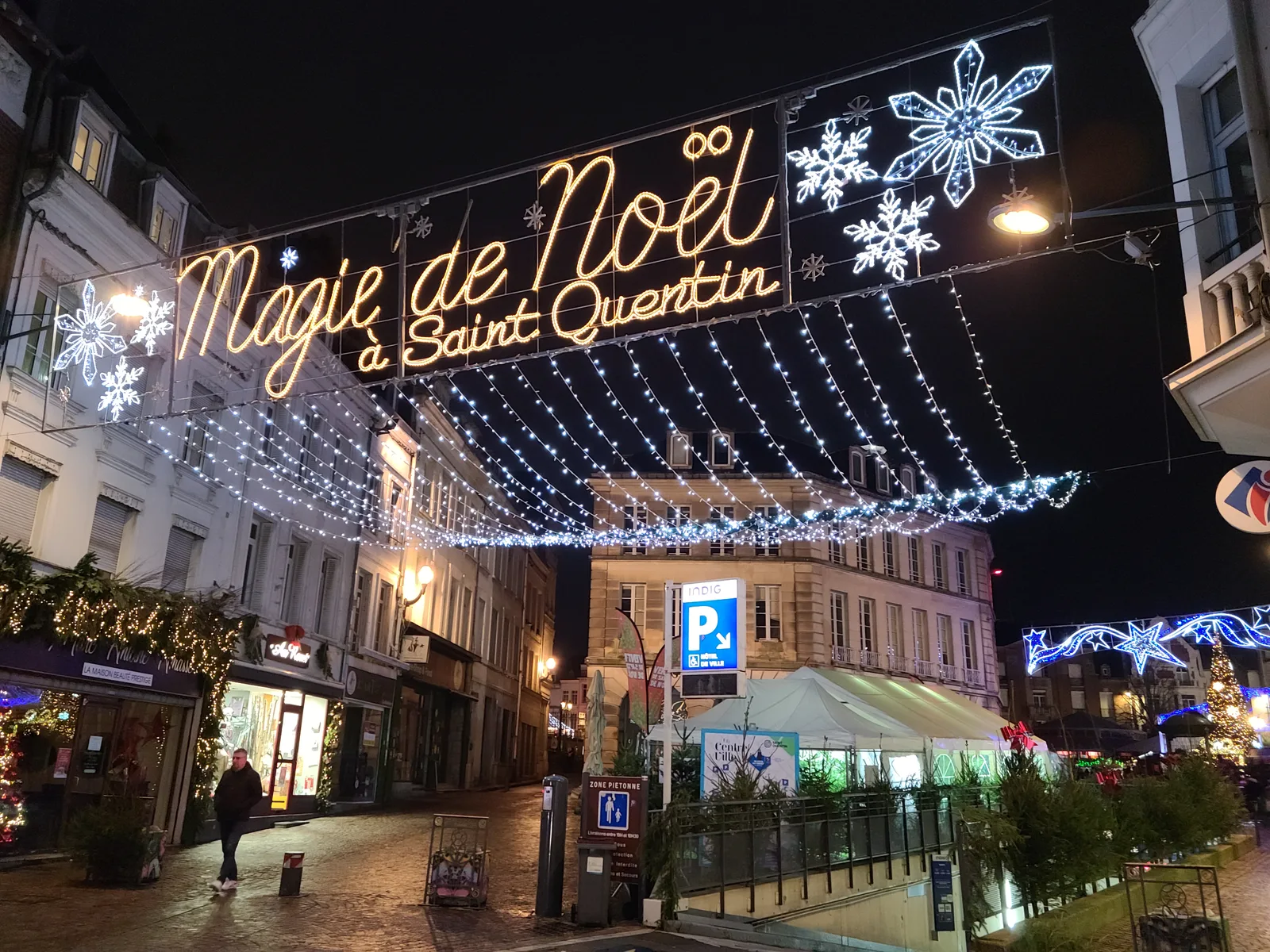Magie de Noël Christmas sign on a festively lit street in Saint-Quentin, Picardy