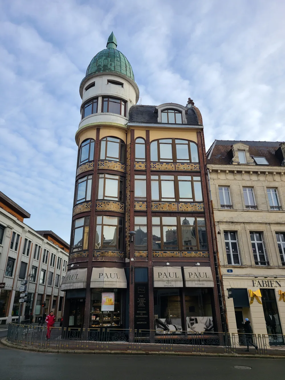 Paul bakery in an Art Nouveau building with ornate stone details in Saint-Quentin