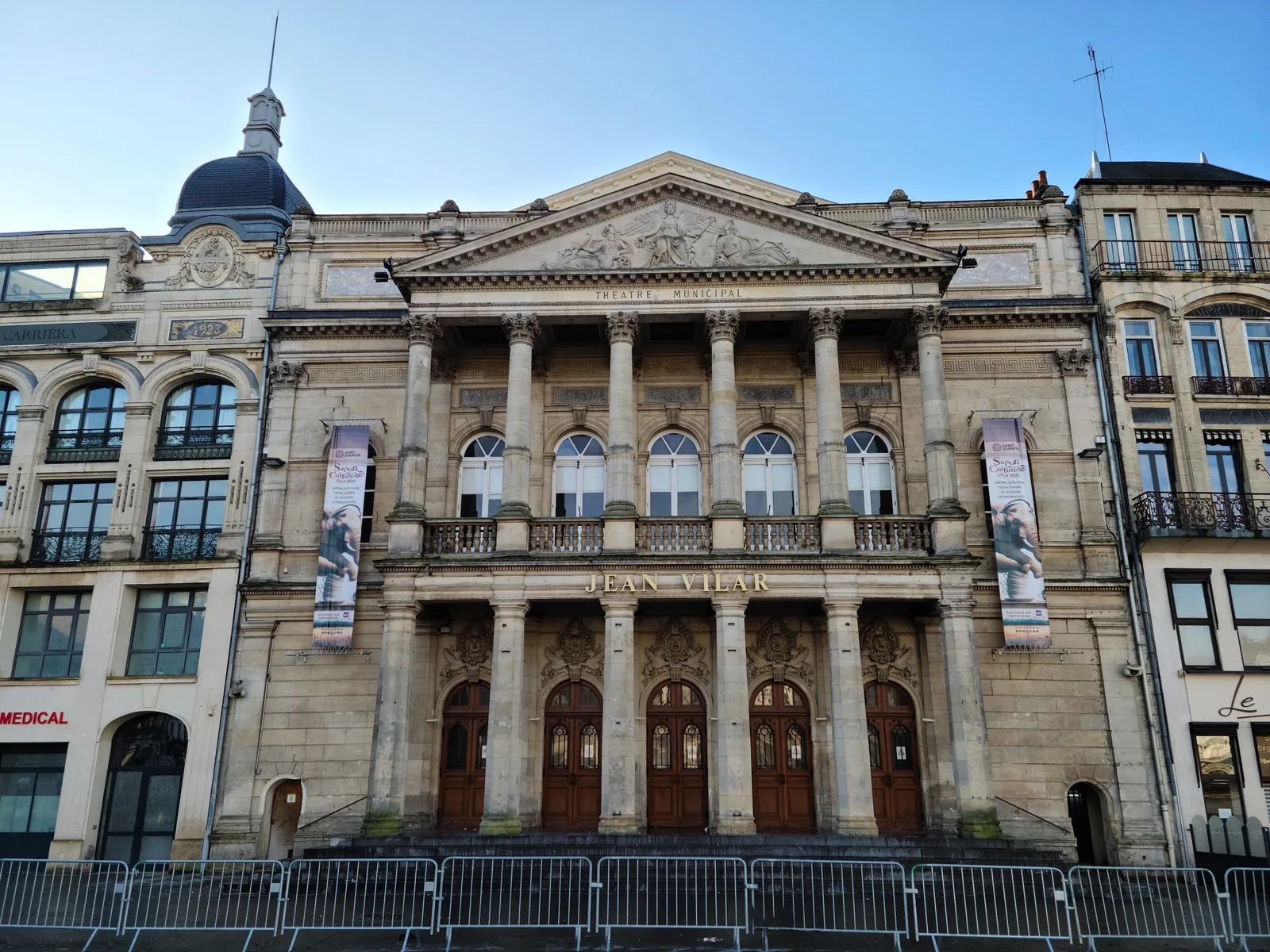 Neo-classical stone facade of the Théâtre Jean-Vilar in Saint-Quentin town center