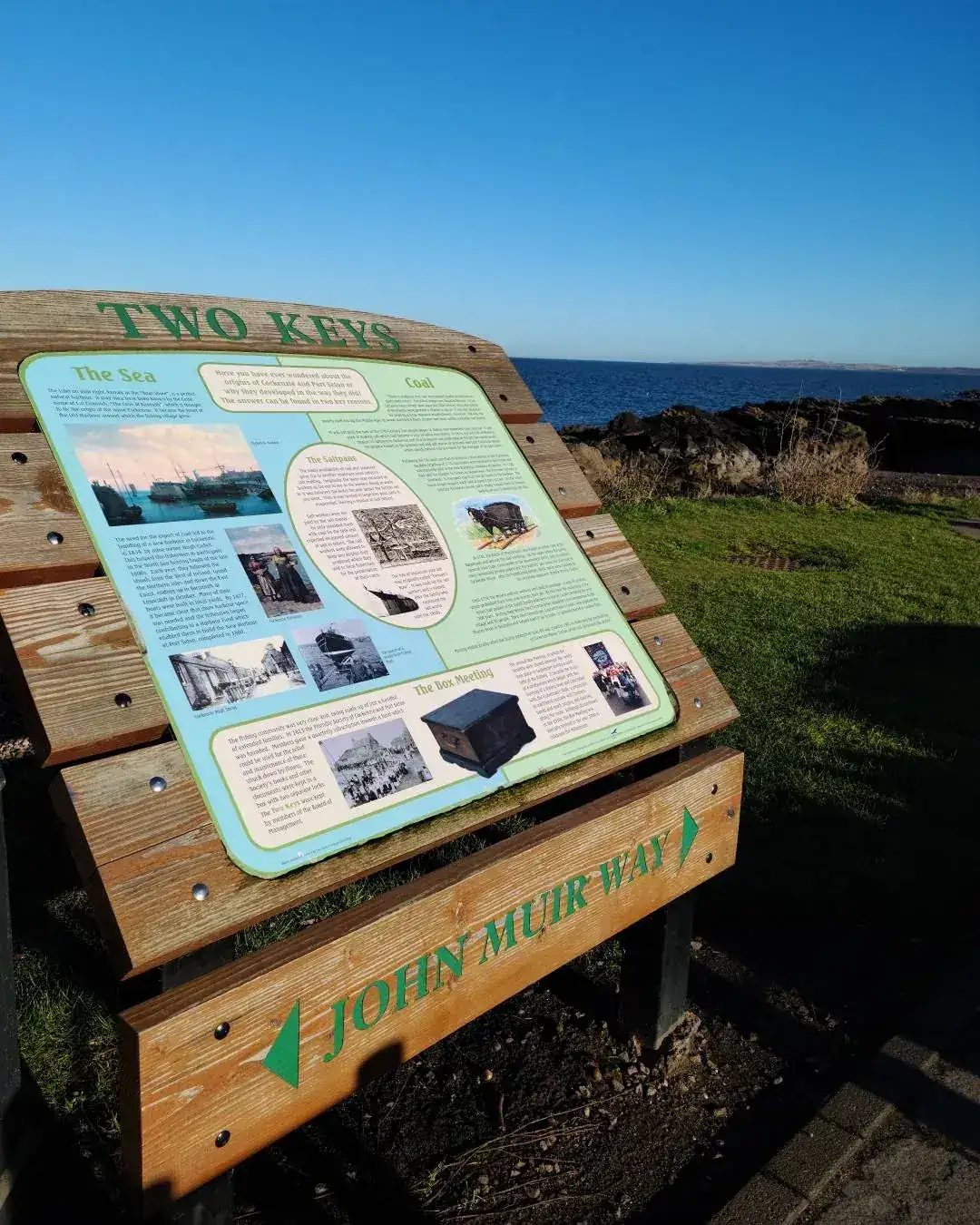John Muir Way information board at Cockenzie with the Scottish coastline in the background